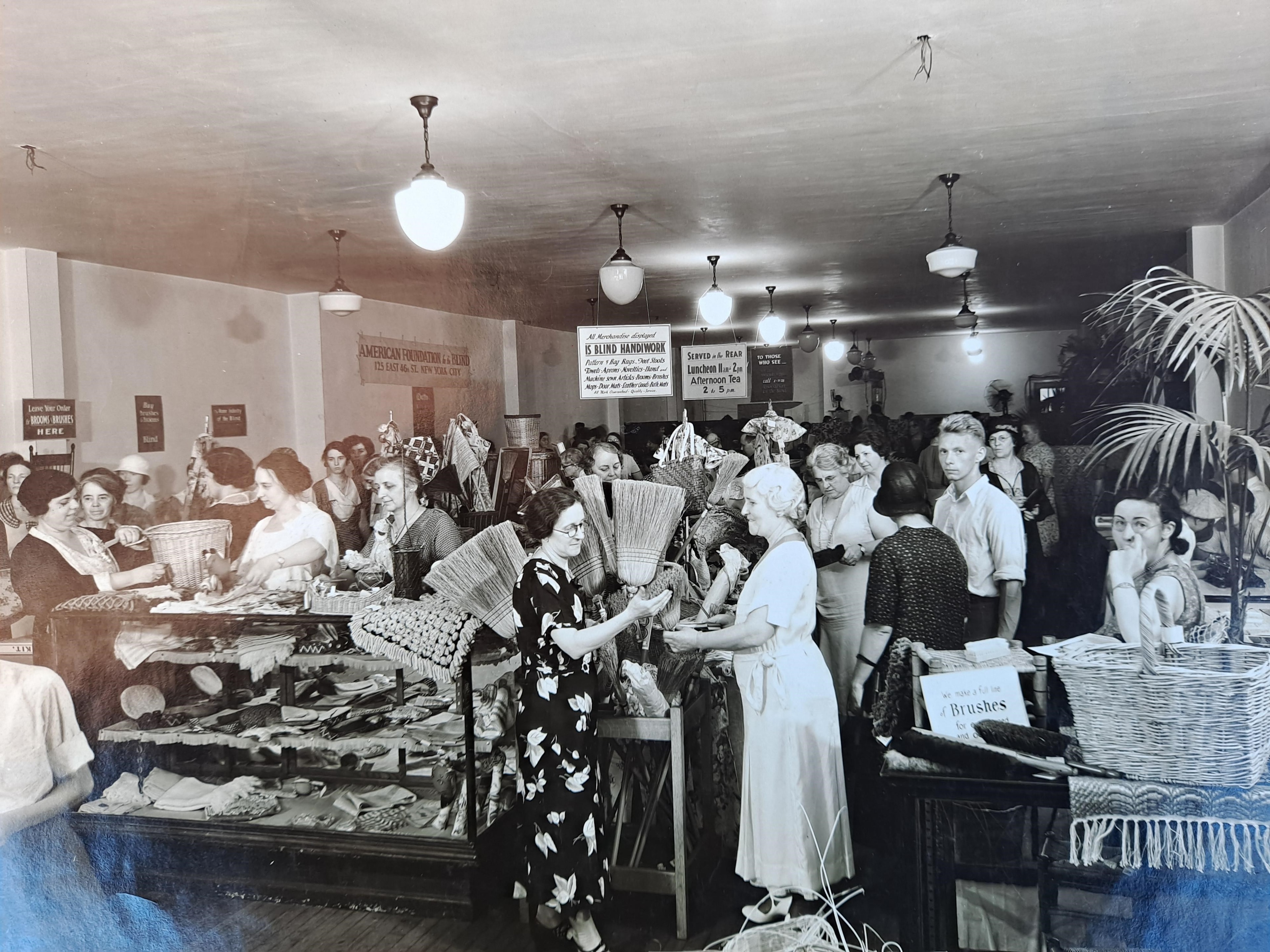 American Foundation for the Blind handiwork shop with customers browsing baskets and crafts made by blind artisans