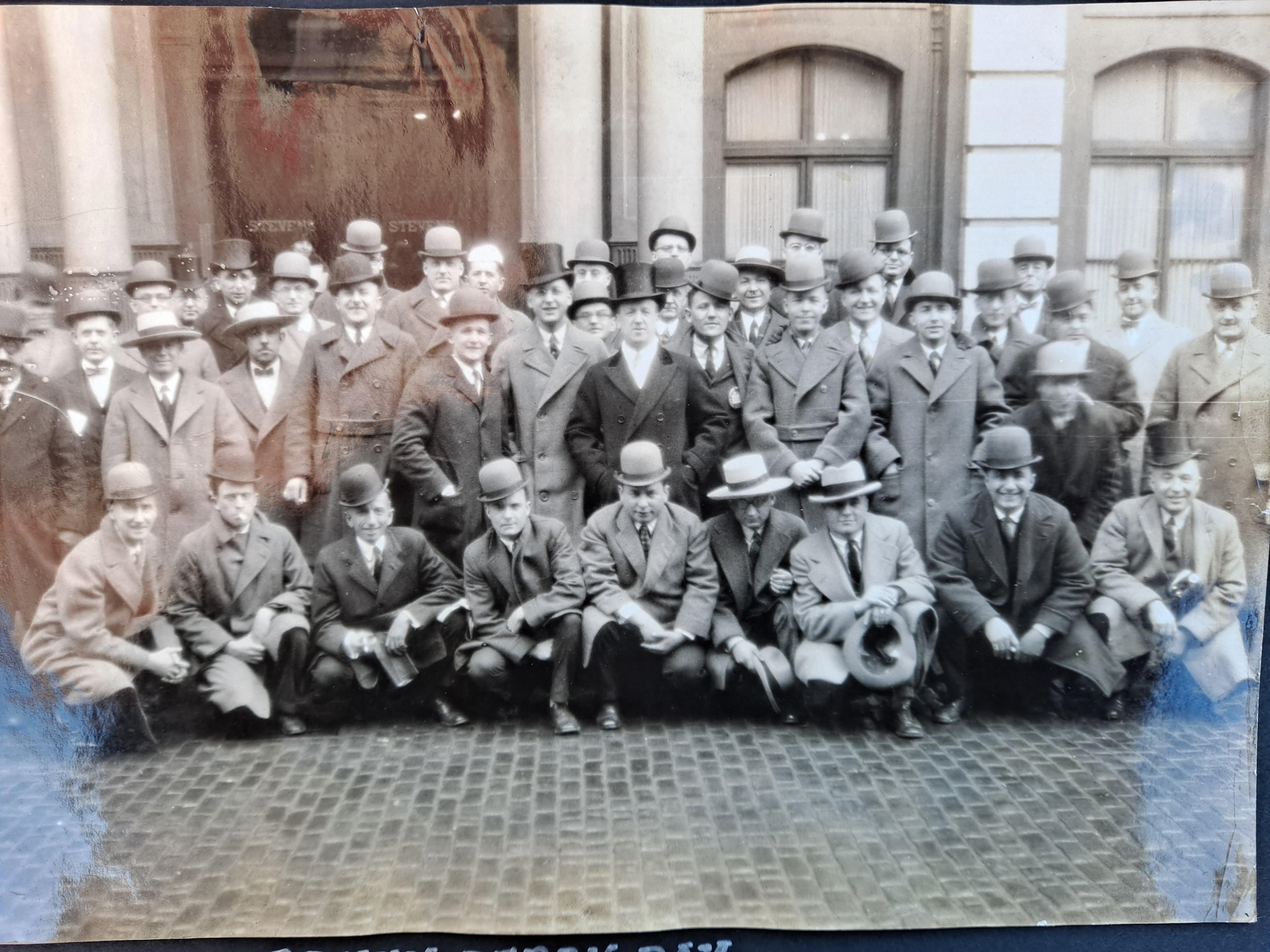 Large group of Lancaster Lions Club founding members posed outside in formal 1920s attire